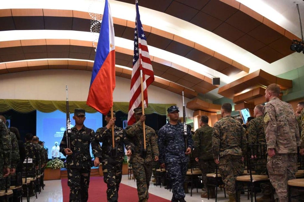 Philippine and US soldiers march with their national flags during the opening ceremony of the annual joint 11-day Balikatan (Shoulder-to-Shoulder) military exercise in Manila. Photo: AFP
