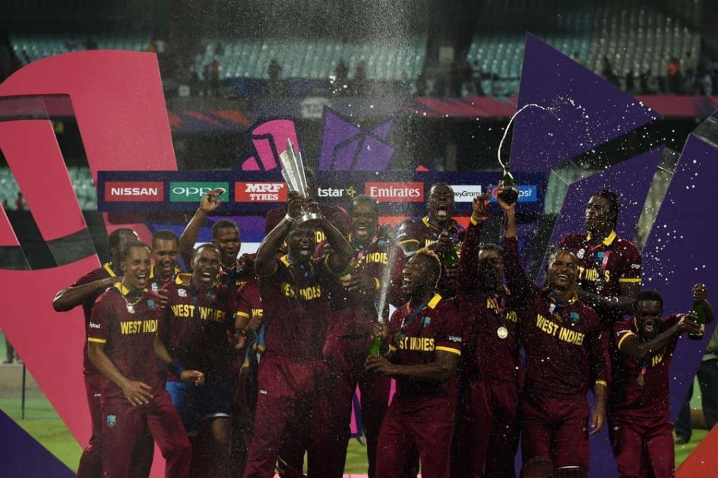 West Indies captain Darren Sammy celebrates with teammates after winning the World T20 final against England. Photo: AFP