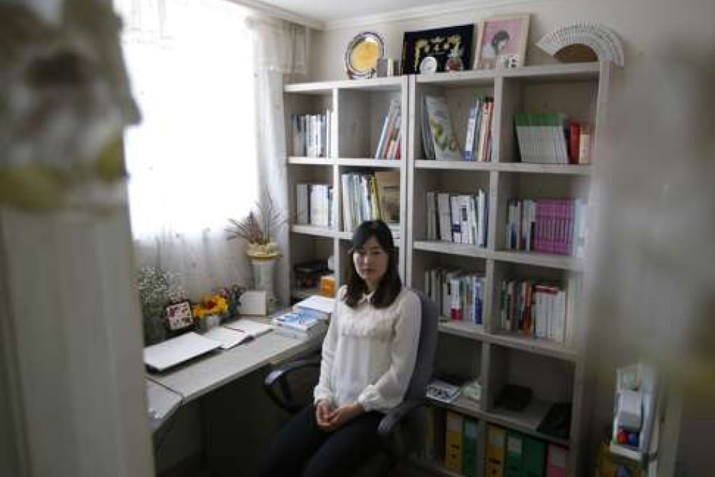 In this March 25, 2016 photo, exiled North Korean Gae-yoon Lee poses for a photo at her home in Seoul, South Korea. Lee, who was raised on a collective farm, left North Korea in 2010 with only a high school diploma. Six years later, she’s a published poet who often writes about her childhood and the famine, and is midway through a degree in Korean literature at one of Seoul’s top universities. (AP Photo/Lee Jin-man)