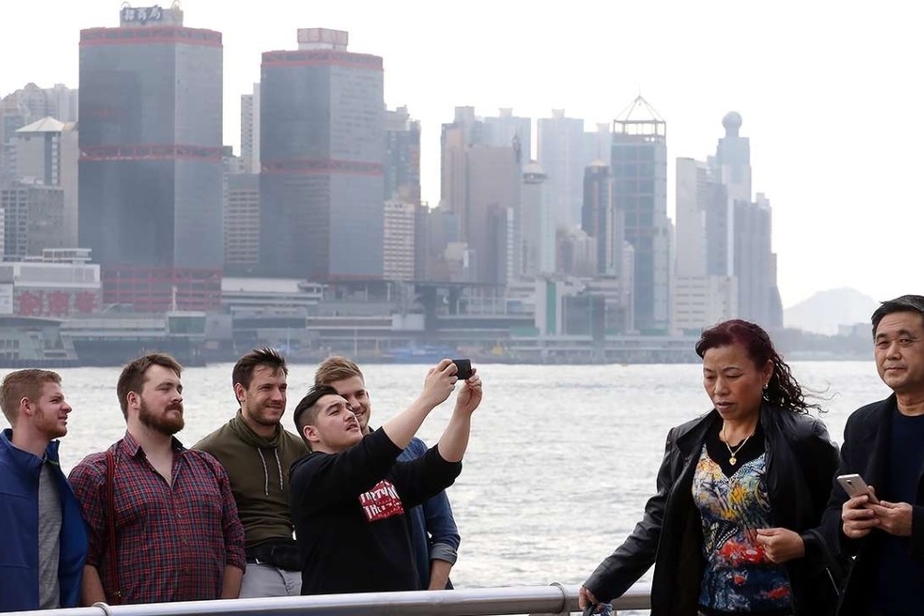 Tourists at the Tsim Sha Tsui waterfront in December. Photo: Felix Wong