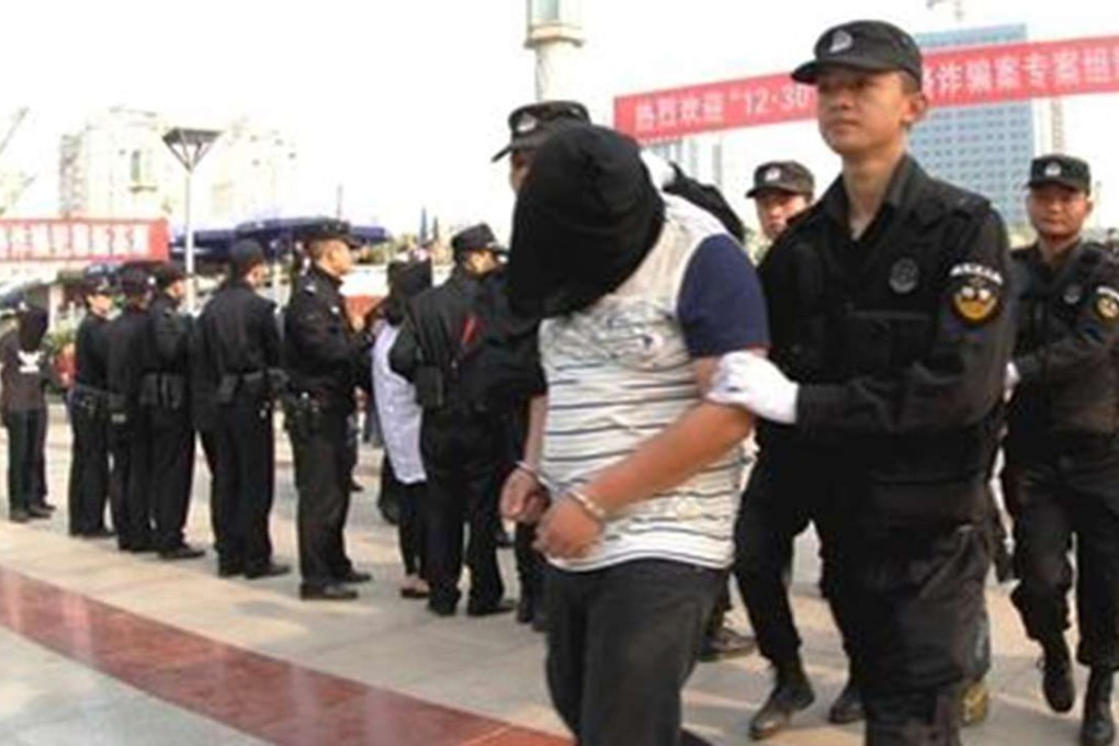 Suspects caught in the operation are paraded by the police. Photo: SCMP Pictures