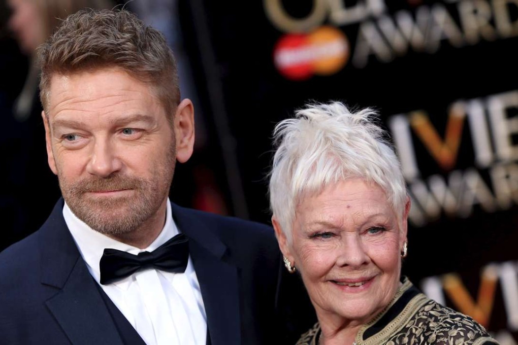 British actors Kenneth Branagh and Judi Dench pose for photographers as they arrive at the Olivier Awards at the Royal Opera House in London,. Photo: Reuters
