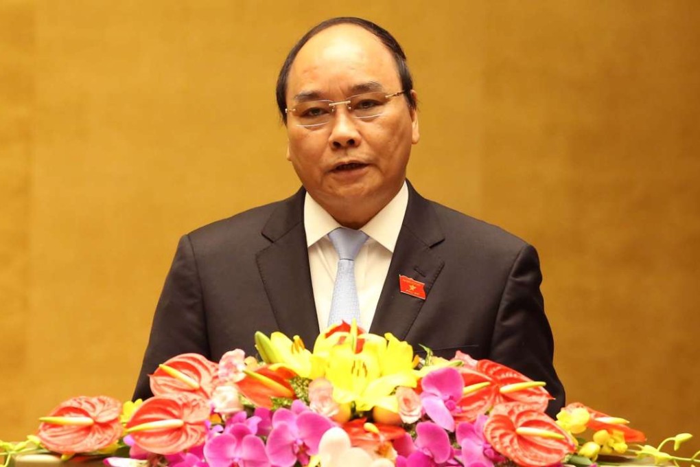 Nguyen Xuan Phuc delivers a government report in Hanoi on March 21, 2016. Photo: Xinhua