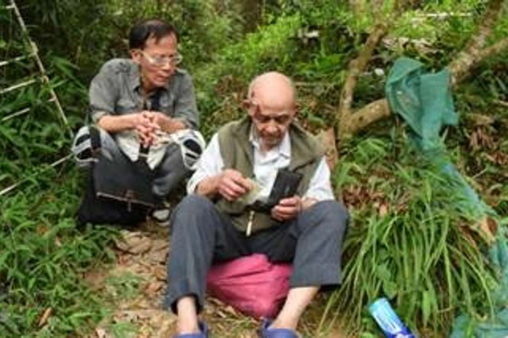 The elderly man takes a rest before he is taken to hospital. Photo: SCMP Pictures