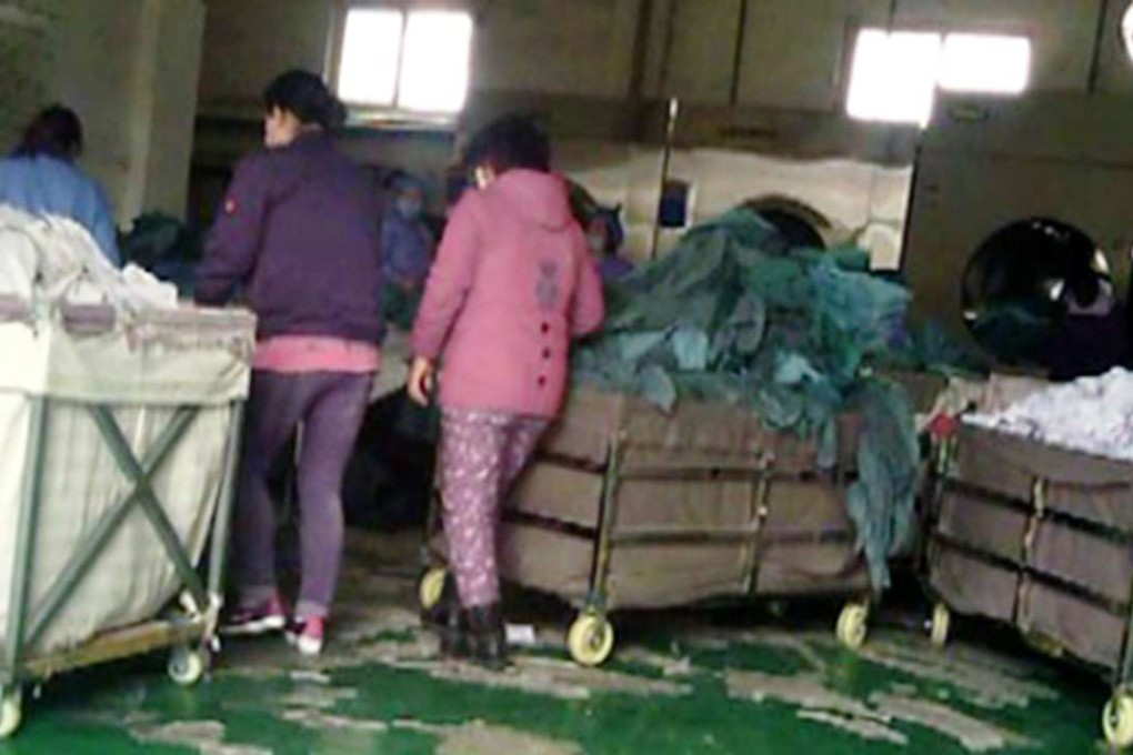 Staff at the laundry service, which denied violating sanitation standards but was forced to close by local authorities. Photo: SCMP Pictures