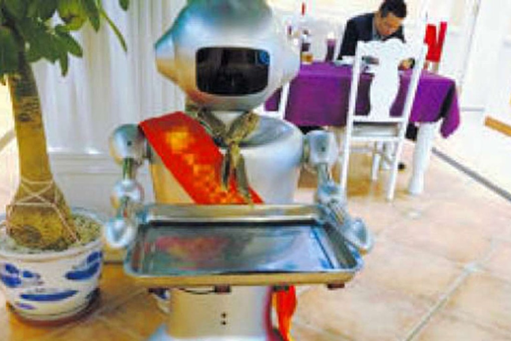 The use of four robot waiters in one restaurant in the city of Xiamen made national headlines. Photo: Xiamen Daily