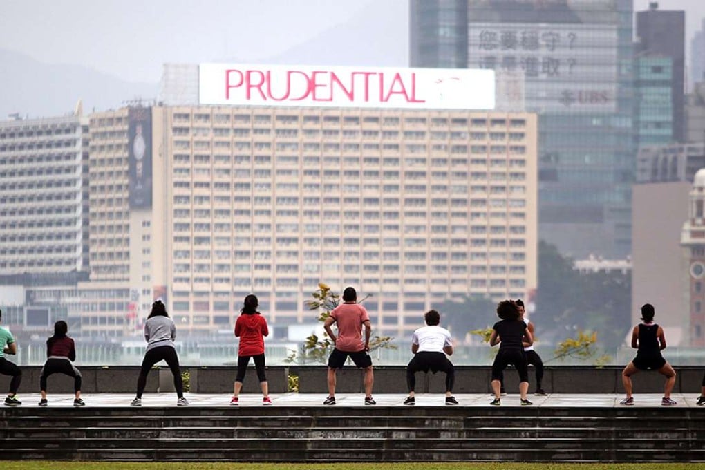 People do their morning exercises at Tamar Park. Photo: Sam Tsang