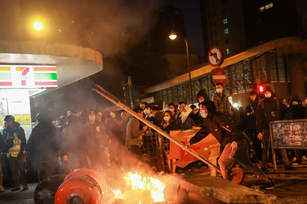 Rioters set fires and threw bricks at police in Hong Kong on the first night of Chinese New Year holiday. Photo: Bloomberg
