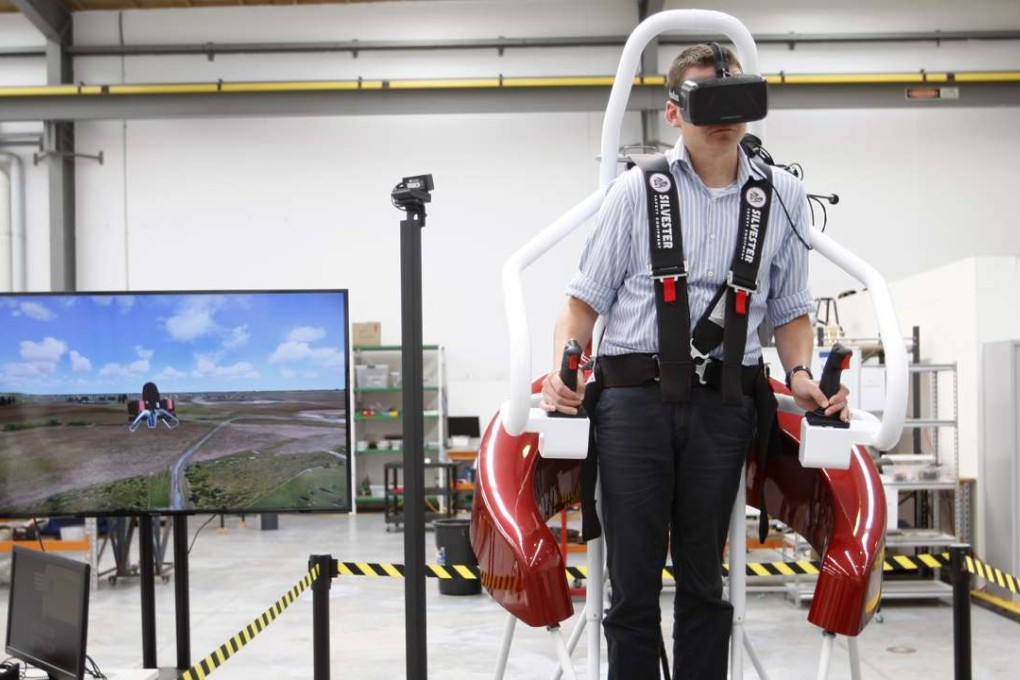 A test pilot operates a flight simulator at the Martin Aircraft headquarters in Christchurch. Photo: AP