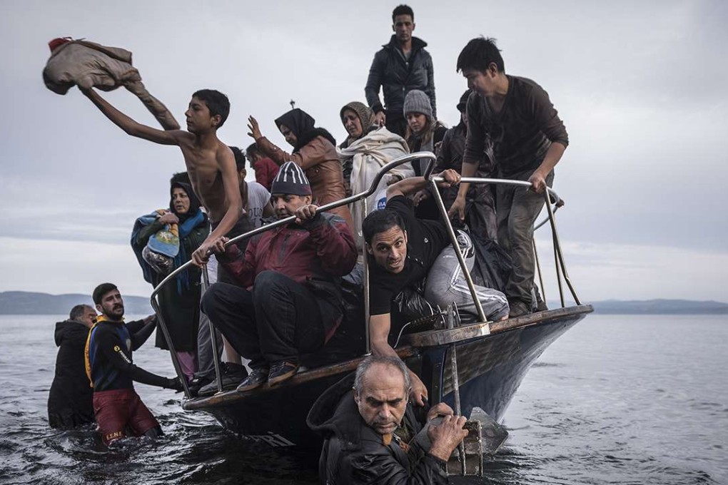 Picture of the Year went to “Europe Refugees” by Sergey Ponomarev, showing migrants arriving at the Greek island of Lesbos.