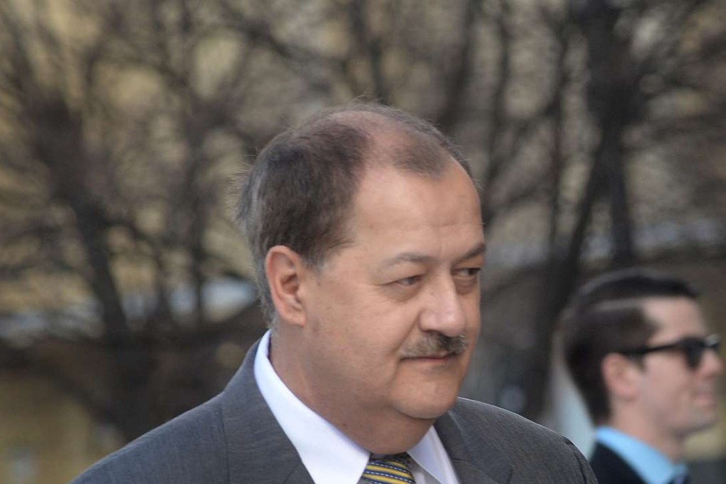 Don Blankenship is escorted by homeland security officers from the courthouse. Blankenship was sentenced to a year in prison and a US$250,000 fine for his role in the Upper Big Branch Mine explosion. Photo: AP
