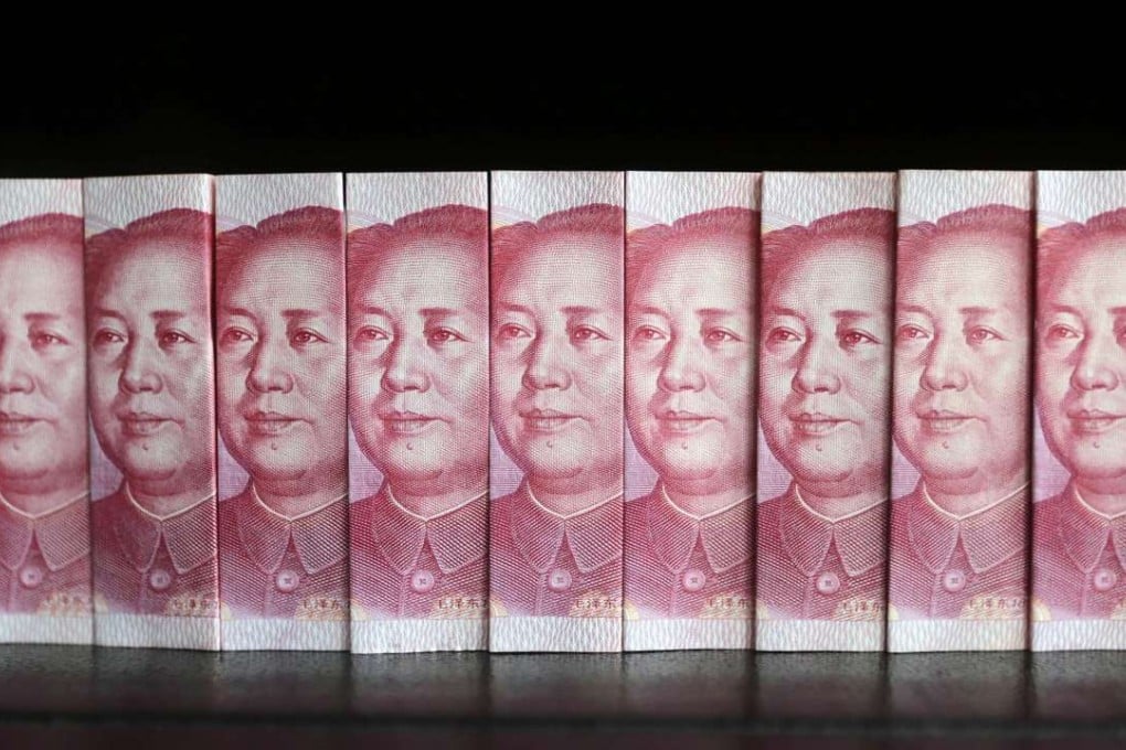 Chinese 100 yuan banknotes. China’s debt burden is growing faster than its economy and is a risk to the continent’s economy, analysts say. Photo Reuters, Jason Lee