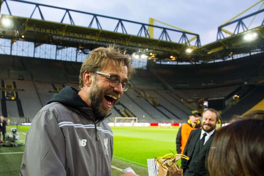 Liverpool manager Juergen Klopp signs autographs on his return to Signal Iduna Park in Dortmund. Photo: EPA