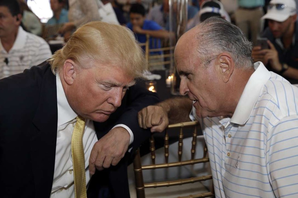 Republican presidential candidate Donald Trump, left, talks the former New York City mayor Rudy Giuliani at a fundraising event in the Bronx last summer. Photo: AP