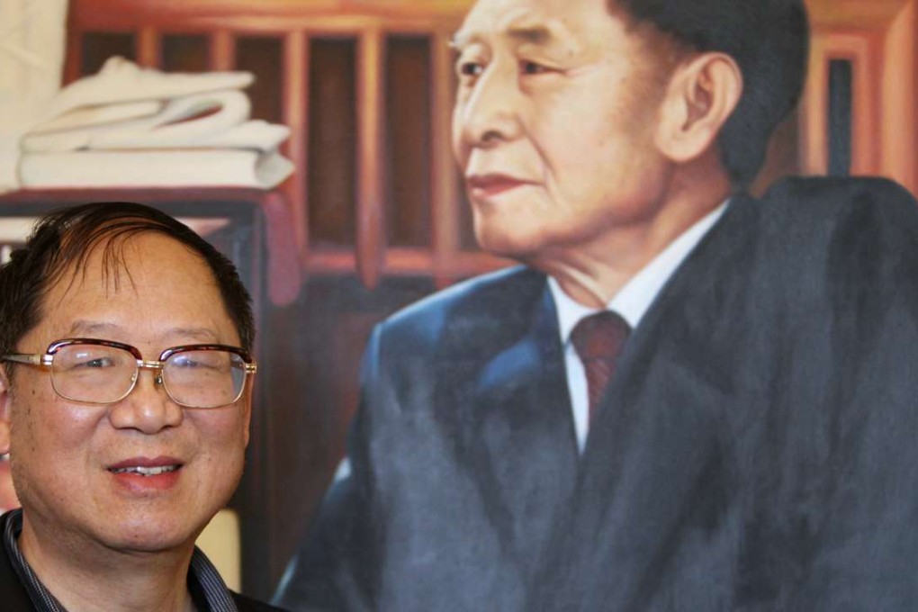 Hu Dehua, youngest son of former general secretary of Communist Party of China Hu Yaobang, pictured in 2014 beside a photograph of his late father. File photo: Simon Song