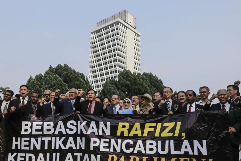Malaysian opposition members of Parliament prepare to march to Bukit Aman Police Headquarters to protest the arrest of Rafizi Ramli in Kuala Lumpur. Photo: EPA