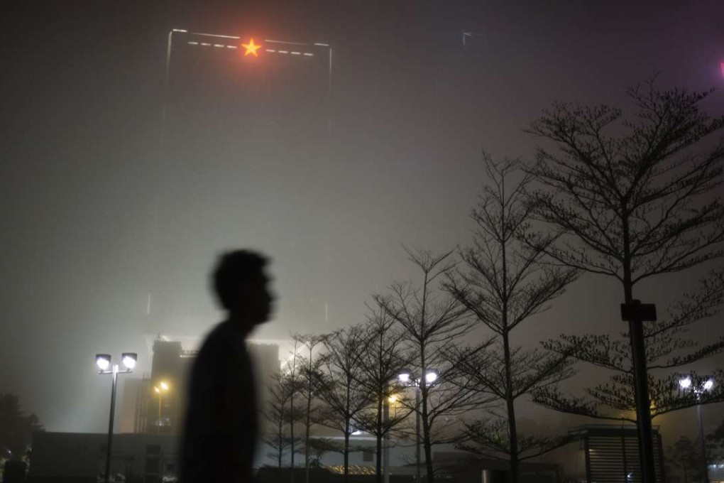 The red star insignia of the People's Liberation Army is seen on top of the force’s building in Central, Hong Kong. Photo: AFP