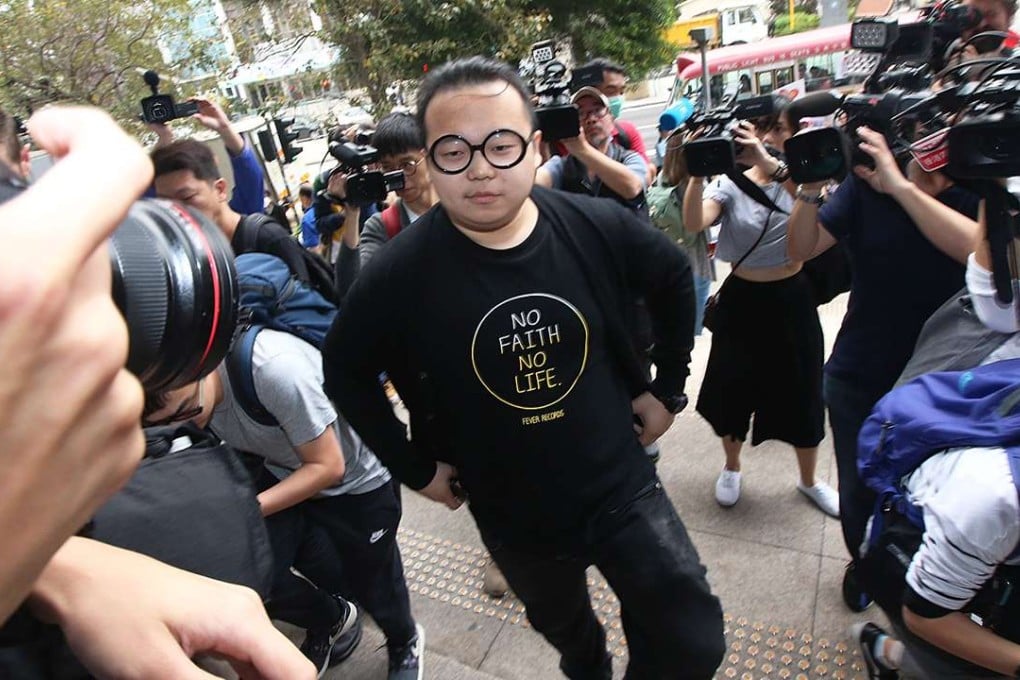 Former Scholarism member Derek Lam (centre) claimed he was a victim of political prosecution. Photo: David Wong