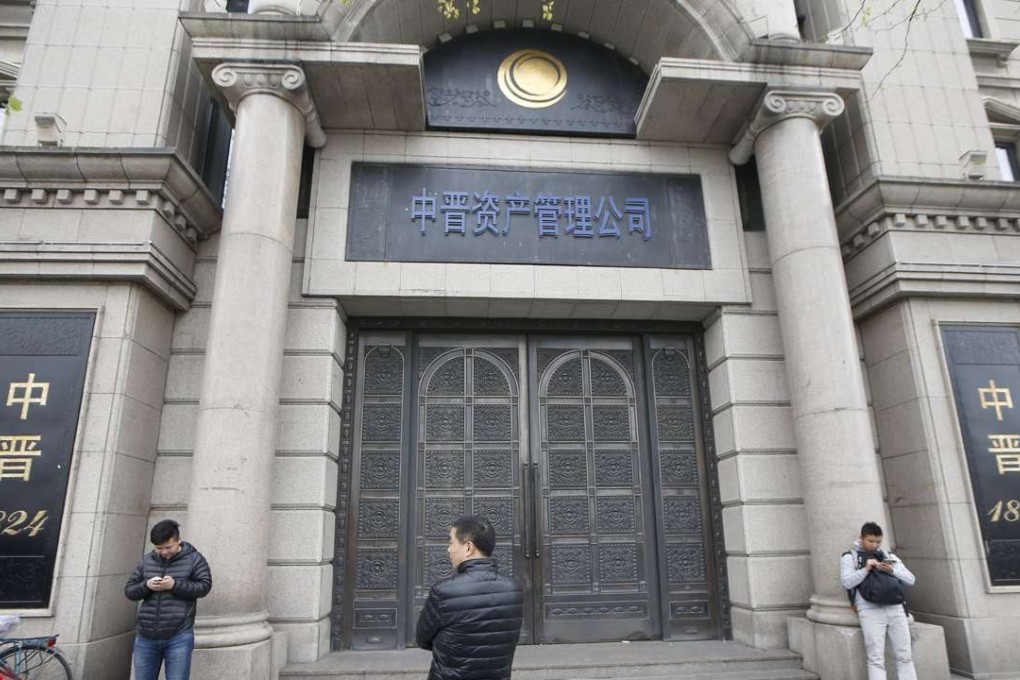 Investors gather at the office of Shanghai investment firm Zhongjin Capital Management in Shanghai yesterday. Photo: Reuters