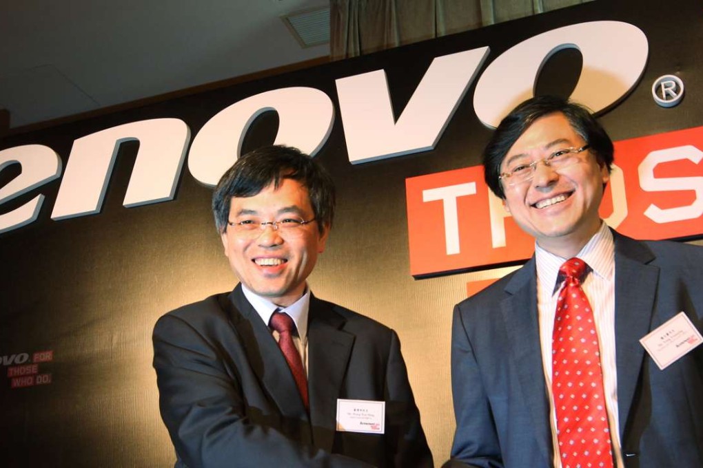 Wong Wai-ming (Left), Chief Financial Officer and Yang Yuanqing (Right), Chairman and Chief Executive Officer of Lenovo Group Ltd., pose for a photo during a news conference on the company's annual results. Photo: May Tse