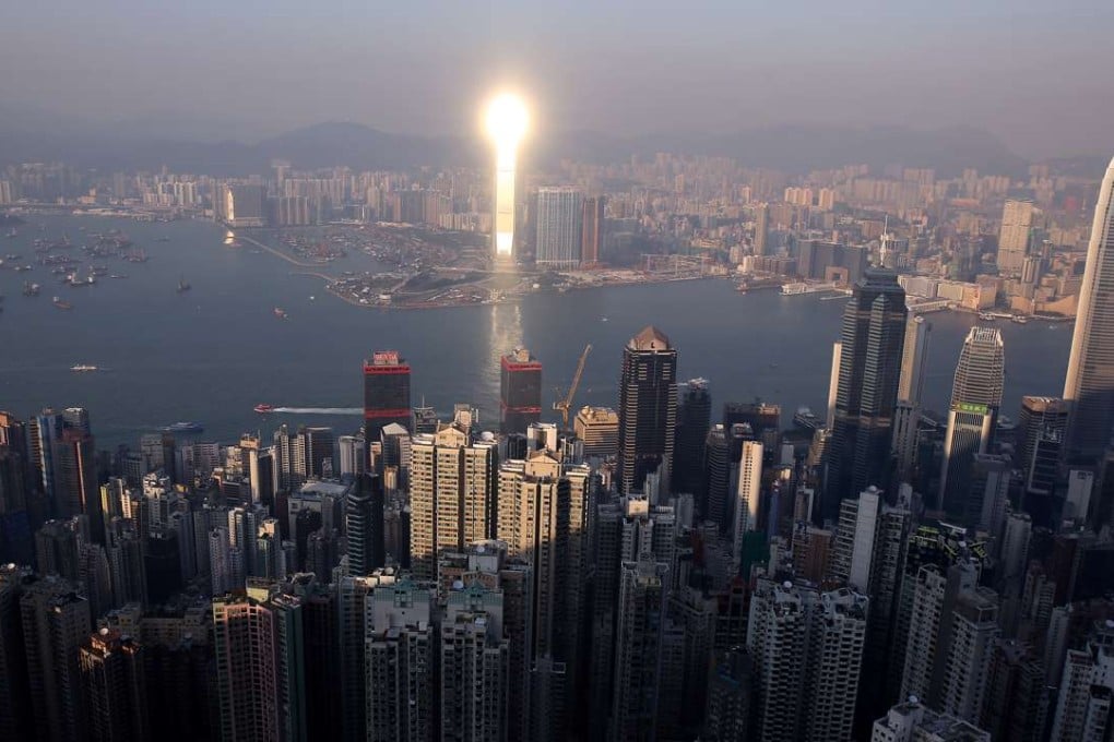 A sunset reflection from the top of ICC building makes the tallest building in Hong Kong look like a flaming matchstick, as Hong Kong’s smog and pollution clears away in the November winter period. Photo: Robert Ng