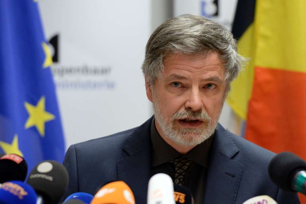 Belgian Federal Magistrate Eric Van Der Sypt talks to the media at the Palace of Justice in Brussels, following the arrest of a key Paris attacks suspect. Key Paris attacks suspect Mohamed Abrini was arrested along with four other people in a series of raids also linked to the deadly Brussels airport and metro bombings, the federal prosecutor's office said. Photo: AFP