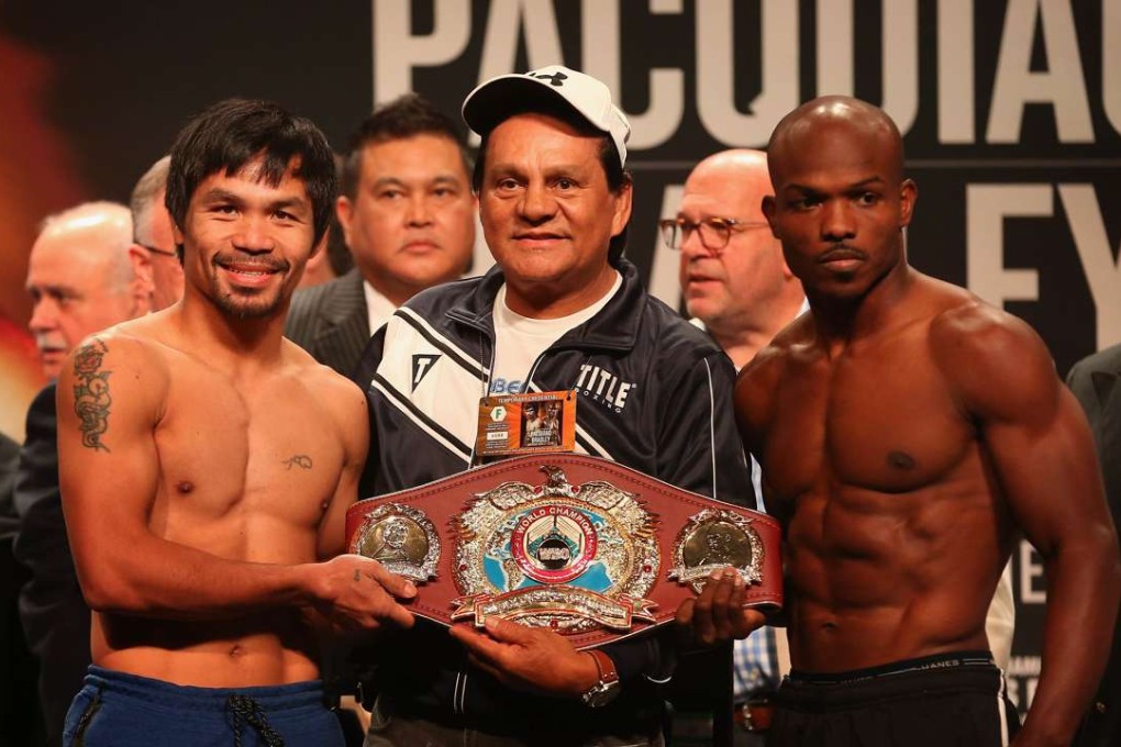 Manny Pacquiao, former boxer Roberto Duran and Timothy Bradley Jnr at the weigh-in. Photo: AFP