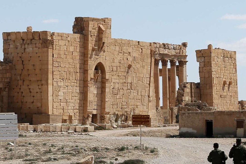 Russian soldiers walk in the ancient Syrian city of Palmyra on March 31. Photo: AFP