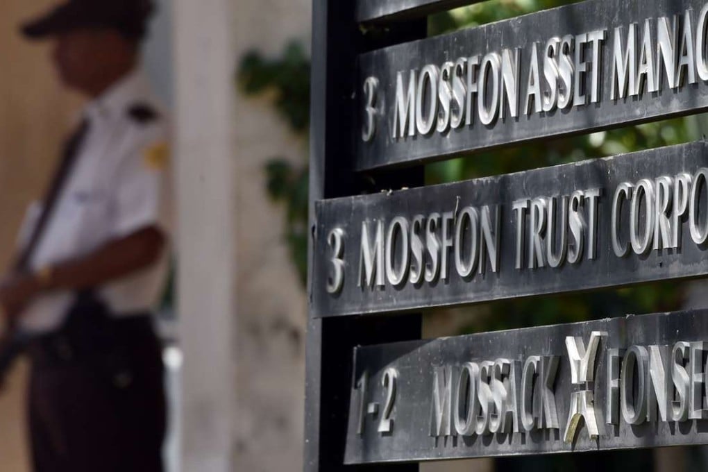 A security guard stands outside the building where Panama-based Mossack Fonseca law firm is based in Panama City on Tuesday. Photo: AFP