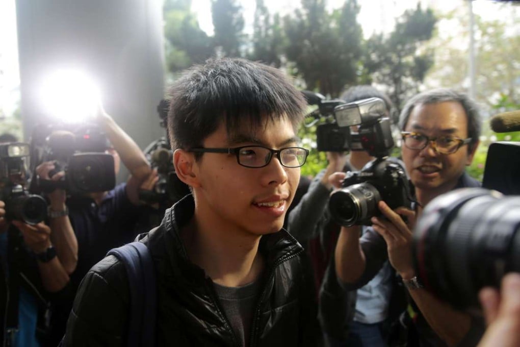 Joshua Wong arrives to court to support the Mong Kok protesters charged with rioting who were due to appear on April 7, 2016. Photo: AFP