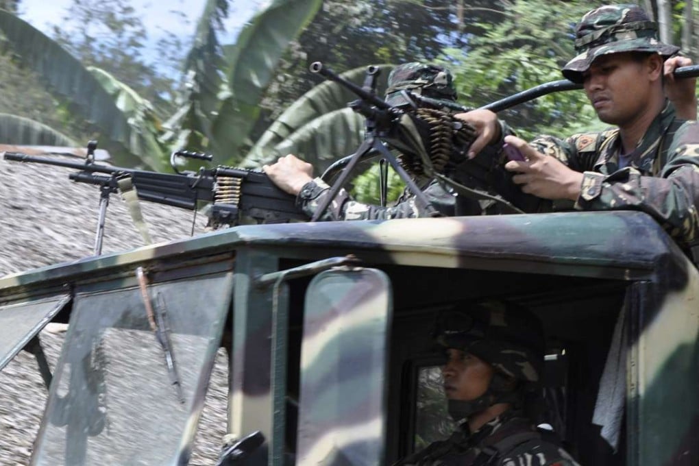 Philippine soldiers head to the mountains to secure the release of foreign hostages on the volatile island of Jolo, southern Philippines, in 2014. File photo: AP