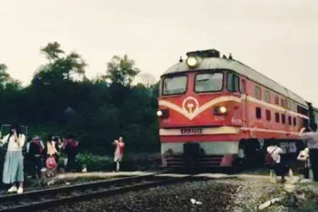 The girl was among a small crowd that had gathered at the railway crossing to take photos of the passing train. Photo: SCMP Pictures