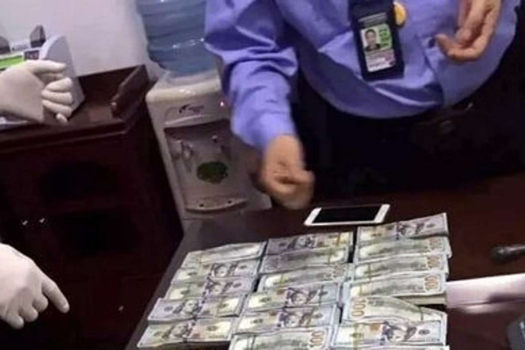 The cash is counted by the authorities. Photo: SCMP Pictures.