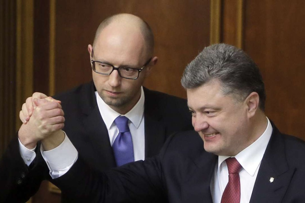 Ukraine’s President Petro Poroshenko, right, and Prime Minister Arseniy Yatsenyuk. Photo: AP