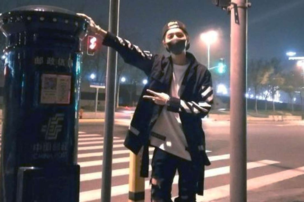Chinese pop star Lu Han poses beside the mailbox on the Bund in Shanghai on Friday. Photo: SCMP Pictures