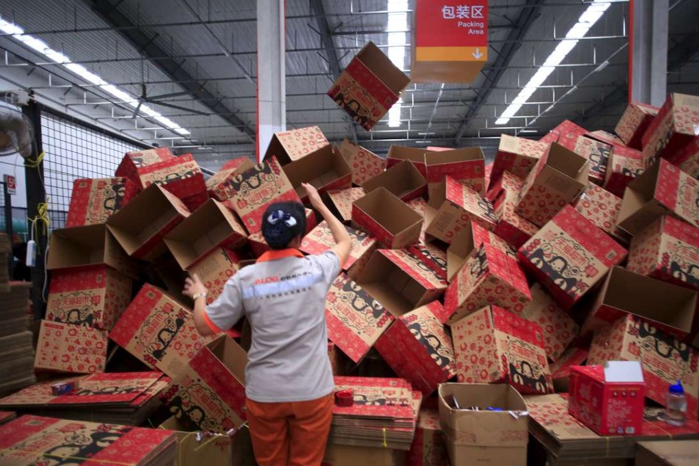 An employee at a Tmall logistic centre in Suzhou, Jiangsu province. China changed the tax rules on online retail goods to level the playing field for e-commerce platforms and traditional retailers and importers. Photo: Reuters