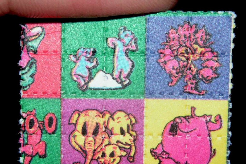 Blotter containing LSD. The state induced by the drug “resembles the state our brains were in when we were infants”, researchers say. Photo: Wikipedia