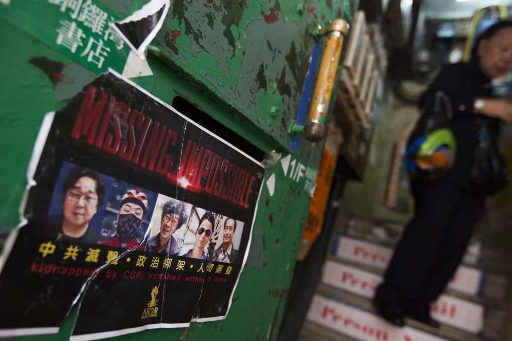 A poster supporting the missing booksellers is seen on the stairs leading up to Causeway Bay Books, just days after Lee Po, the proprietor of the shop, reappeared in Hong Kong. Photo: EPA