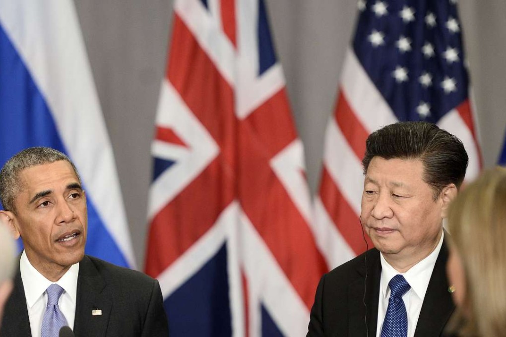 Xi Jinping listens to Barack Obama during the nuclear security summit in Washington. Photo: AFP