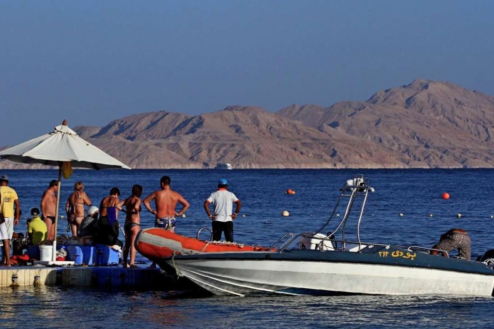 Tourists at the Egyptian Red Sea resort of Sharm el-Sheikh prepare to board a boat facing Tiran island in the Straits of Tiran between Egypt's Sinai Peninsula and Saudi Arabia. Photo: AFP