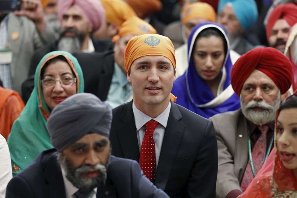 Canada's Prime Minister Justin Trudeau takes part in a Vaisakhi celebration on Parliament Hill in Ottawa on Monday. In front of him is Defence Minister Harjit Sajjan. Photo: Reuters