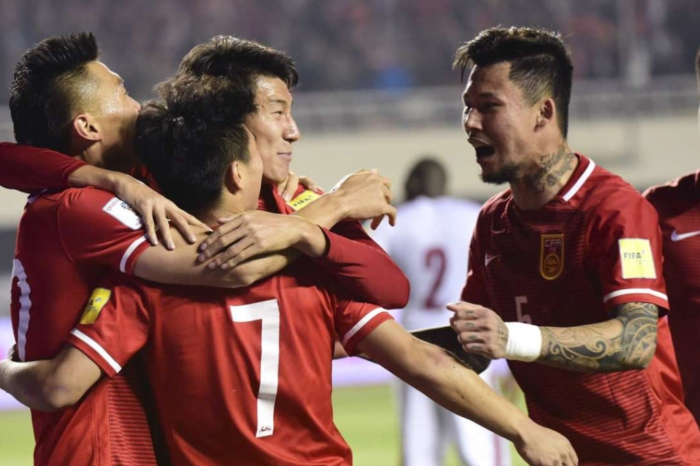 China's Wu Lei (7) celebrates with teammates after scoring against Qatar. Photo: AP