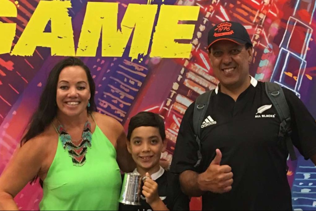 Cooper Rodda holding the cup given to him by Sonny Bill Williams, with his mother Tan Guerin-Rodda and father Jeff Rodda. Photos: courtesy of Tan Guerin-Rodda