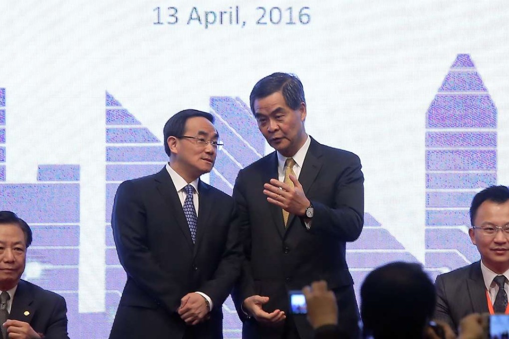 Cyberspace Administration of China Deputy Director Xu Lin(L) with Hong Kong Chief Executive Leung Chun-ying at the Internet Economy Summit at the Hong Kong Convention & Exhibition Centre in Wan Chai. Photo: Dickson Lee