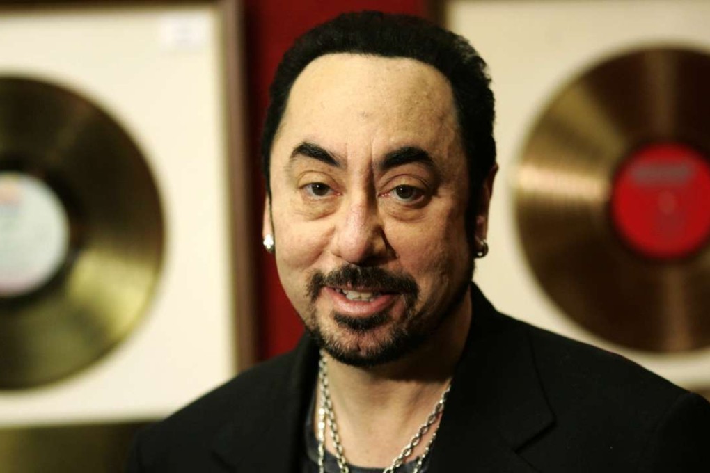 David Gest poses with some of his collection of entertainment memorabilia at an auction house in London ion 2007. Photo: AP