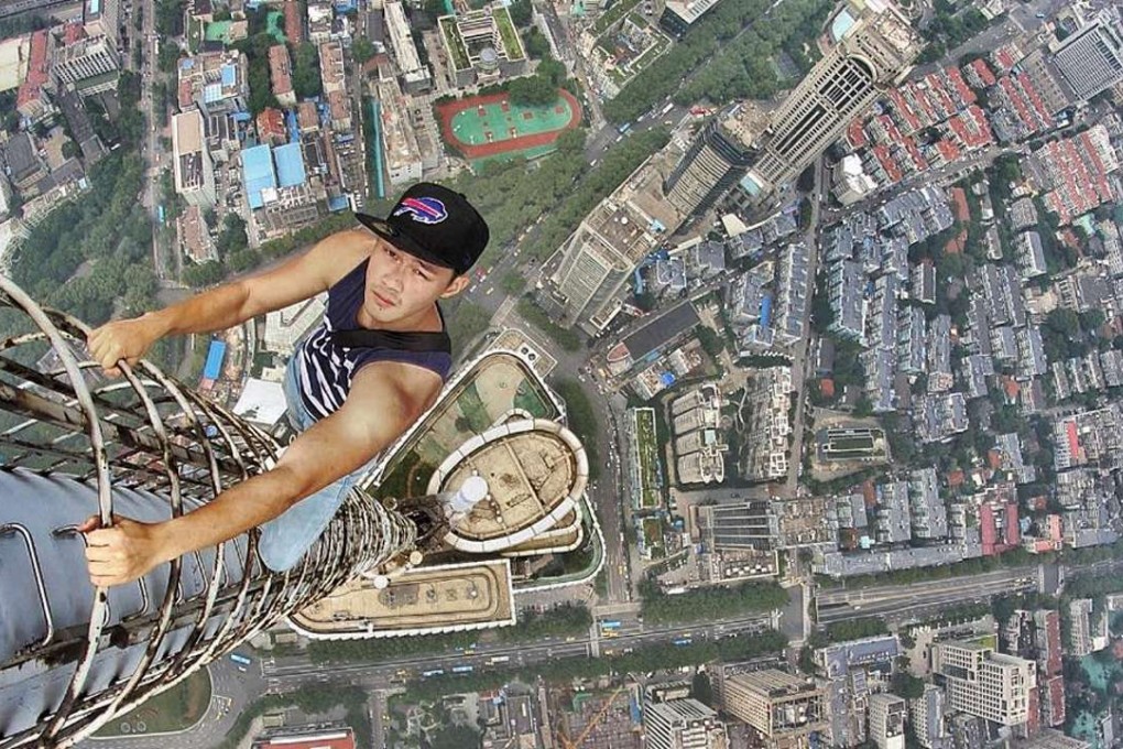 Daniel Lau, poses for a photograph at an unknown location. Lau is a member of Exthetics, a group of photographers who climb to the top of towering buildings to snap. Photo: Daniel Lau