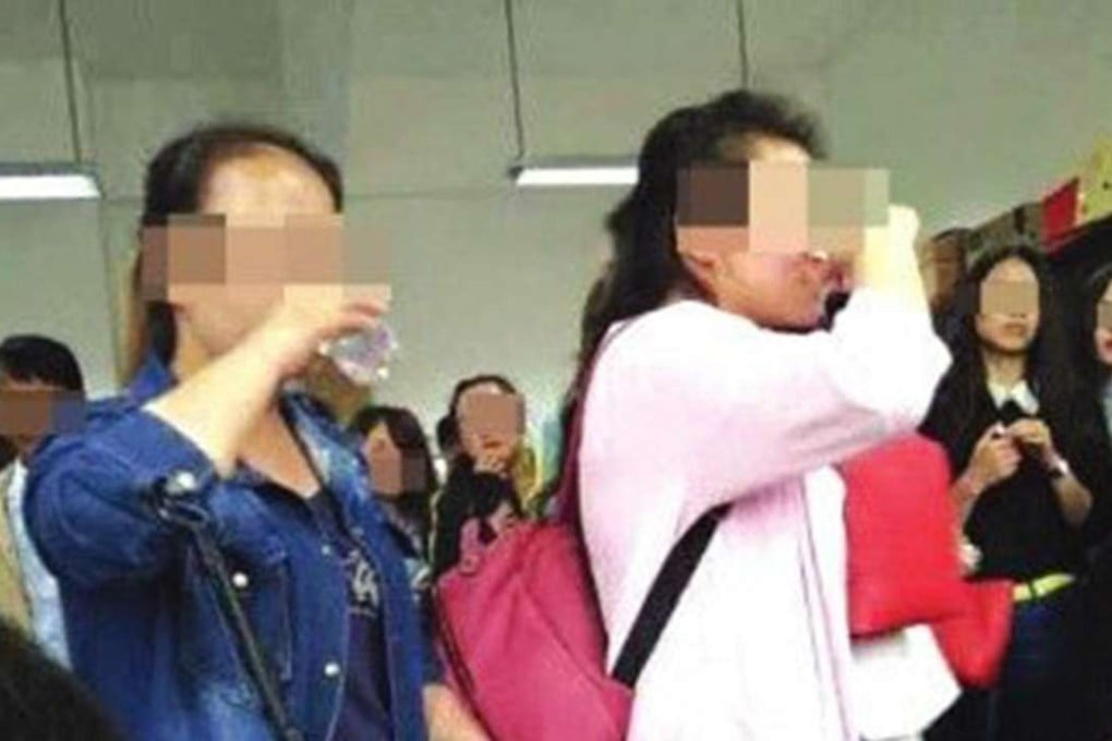 Two students down shots of baiju after the examination. Photo: Guancha.cn