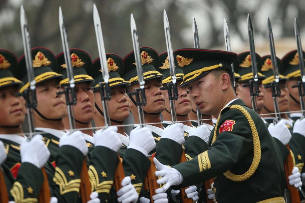 PLA honour guards check their lines before a welcoming ceremony in Beijing in this file photo from March. President Xi Jinping is trying to tackle the causes of corruption within the armed forces. Photo: EPA