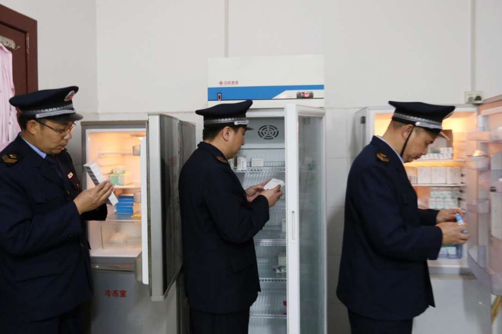 Officials of the State Food and Drug Administration check vaccines stored in the local Centre for Disease Control in Rongan county, in southwestern China’s Guangxi province, in this file photo made available on March 24. Photo: EPA