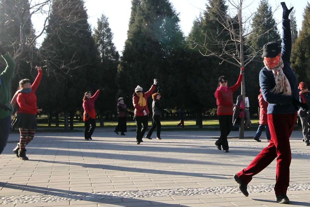 Elderly people take part in a square dance in Beijing. Photo: Simon Song